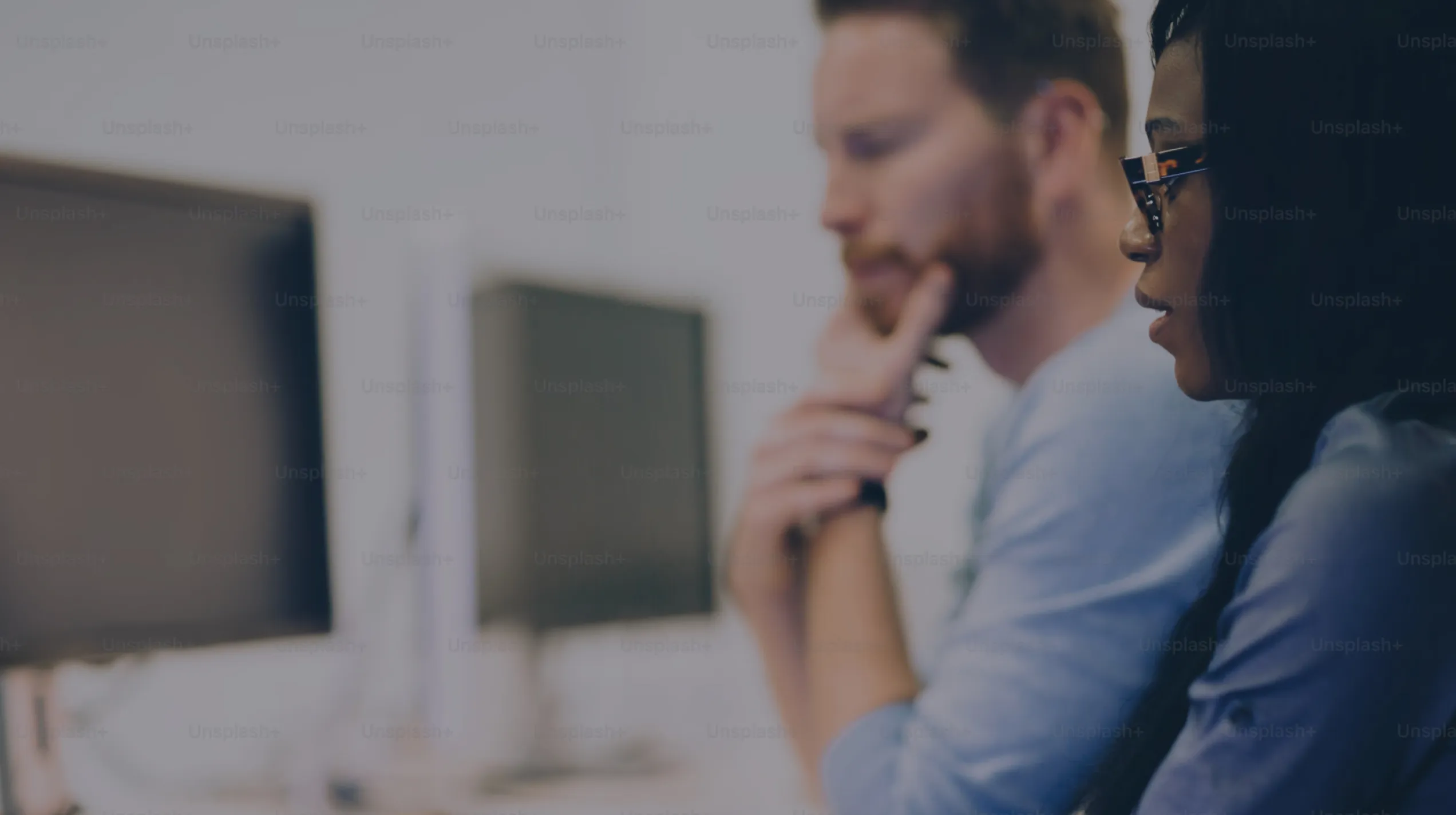 Two people using a computer