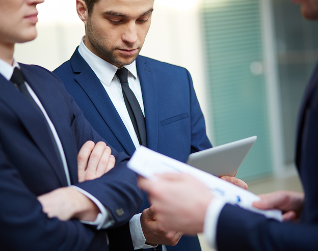 Talonic use case image of business talk, men discussing KPIs, documents, finding the right data