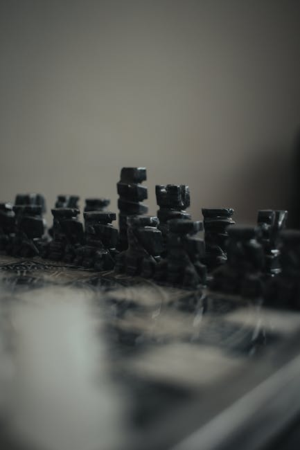 An artistic shot of a blurred chess set emphasizing strategy and leisure activities.