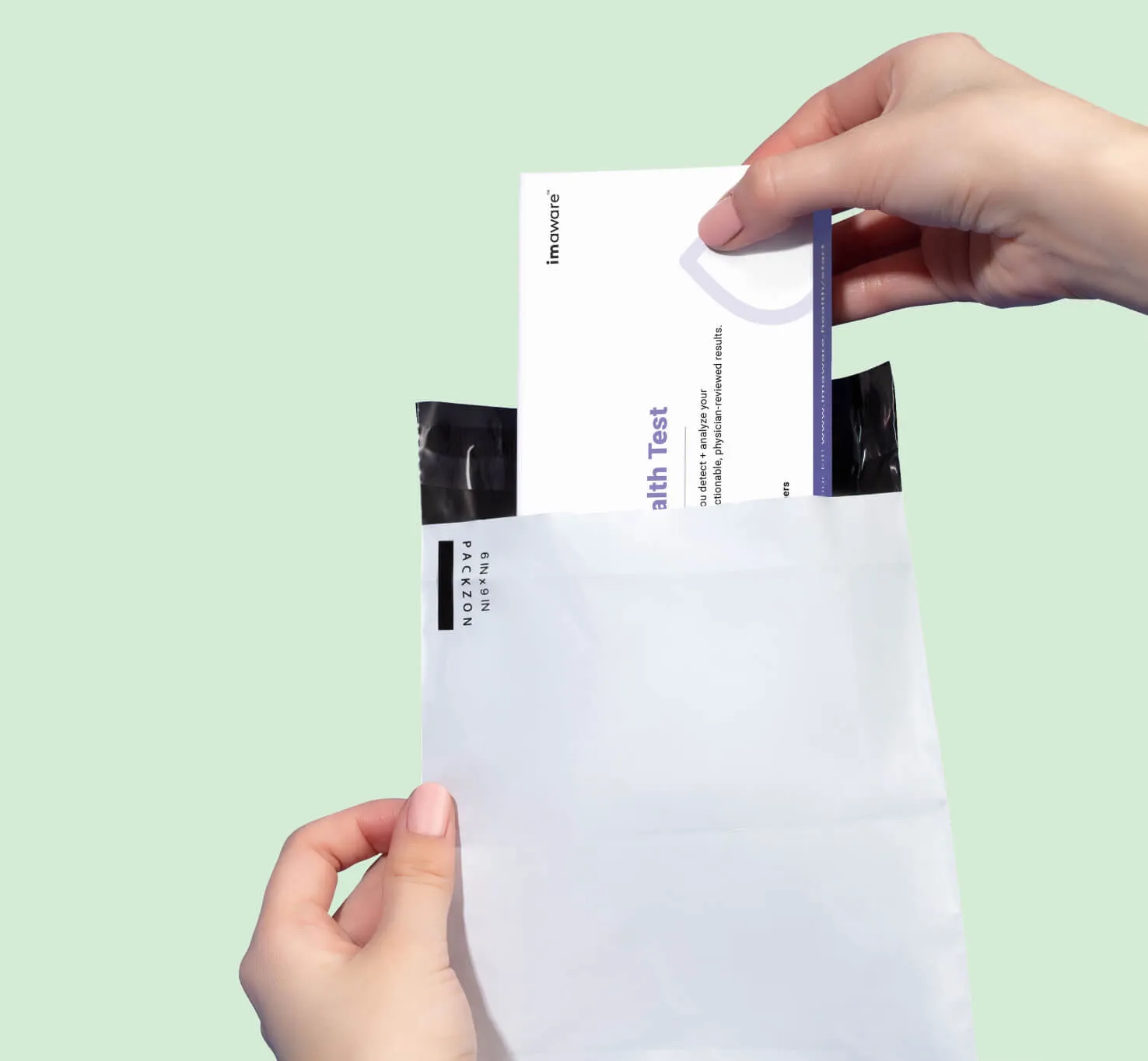 Hands placing a completed test kit into a prepaid mailing envelope