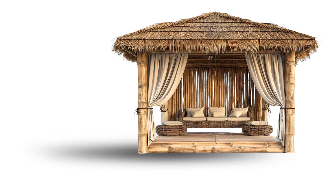 Thatched bamboo gazebo with beige curtains, a cushion-lined bench, and two round woven ottomans.