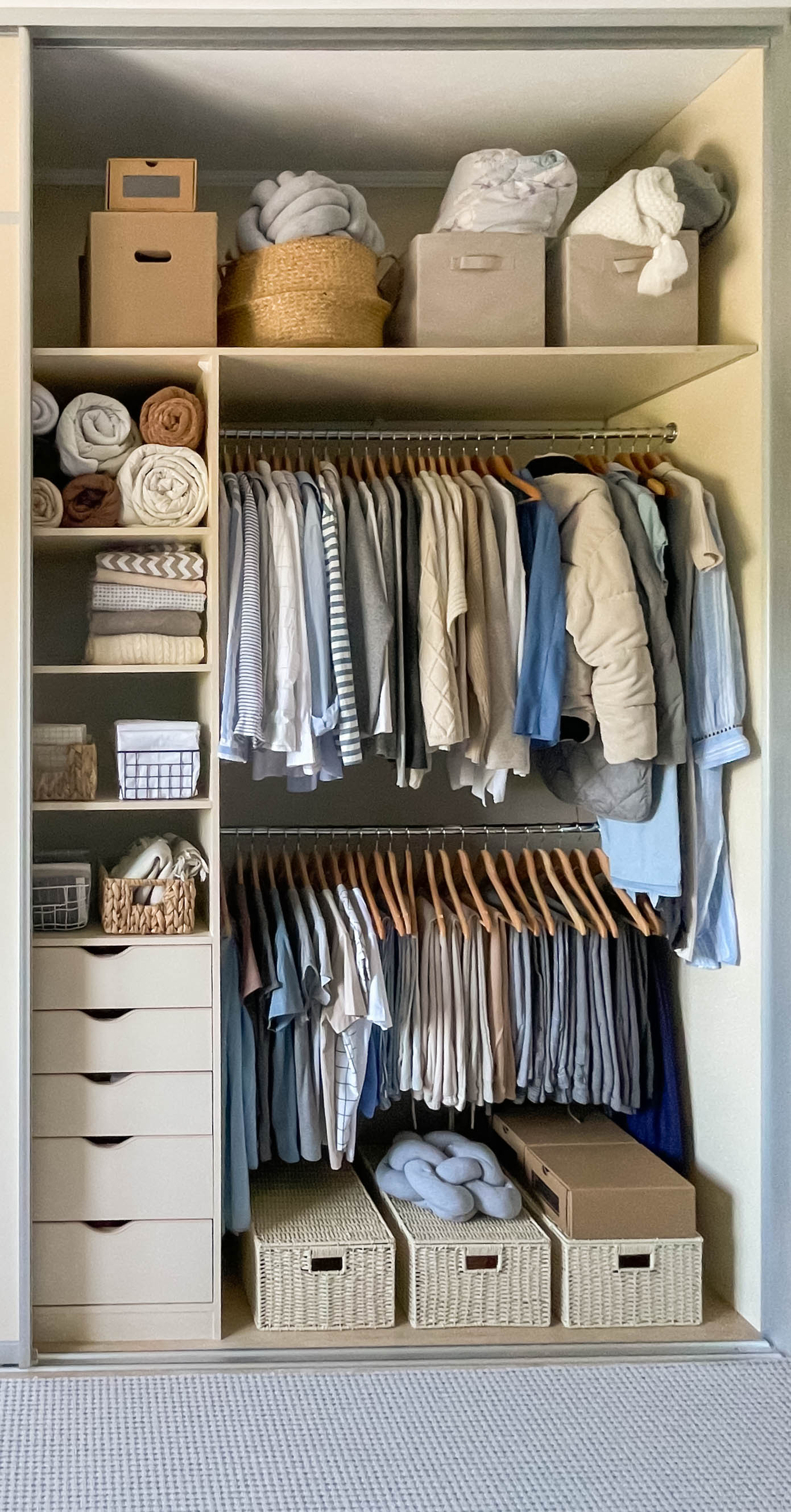 Nicely organized closet with color-grouped clothing