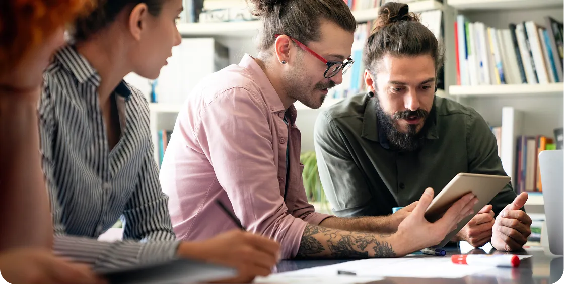 4 People on Ipad in office