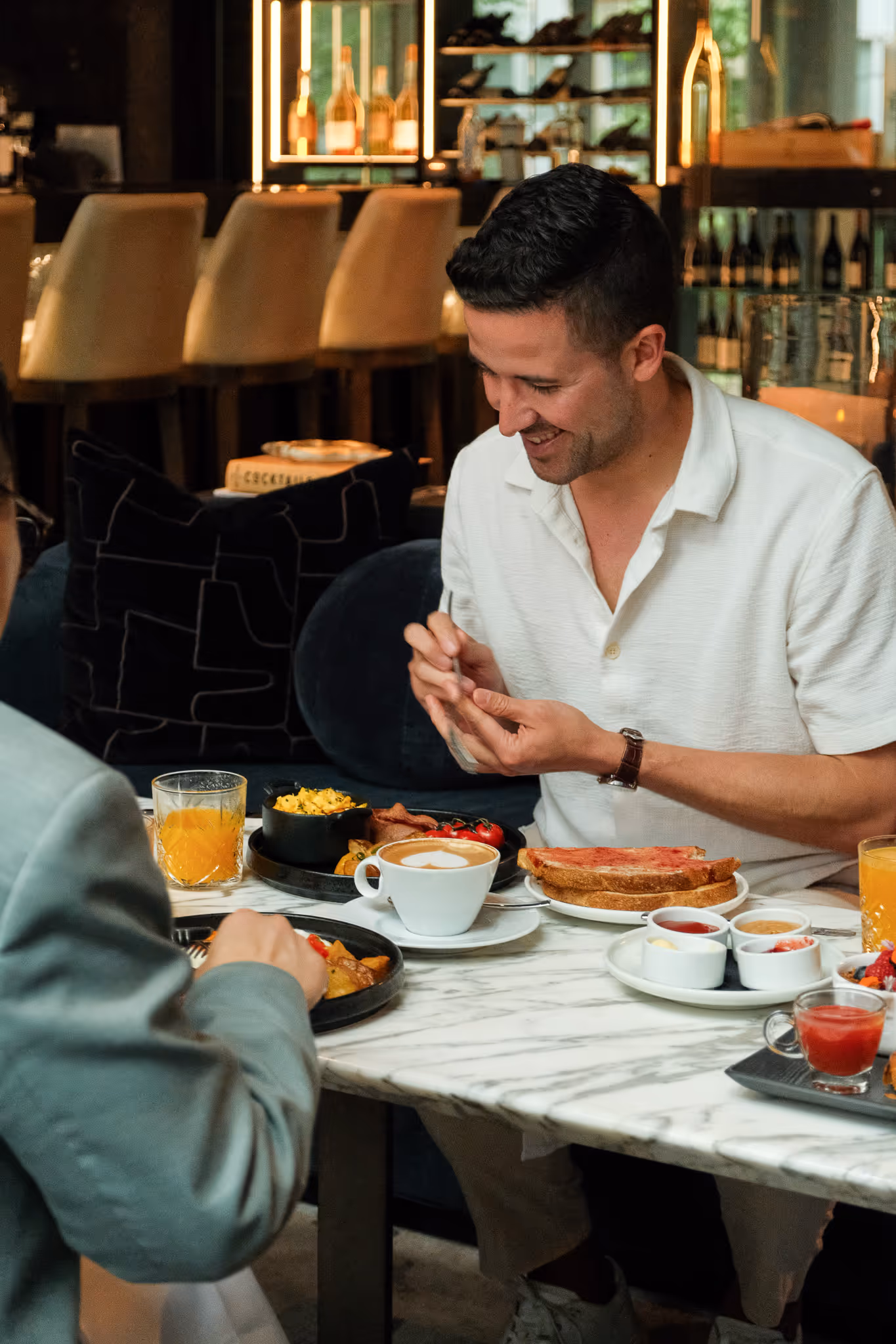 Friends have breakfast together at Paradox Hotel Vancouver