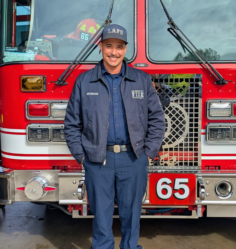 Engineer Brandon Colburn standing in front of an LAFD engine.