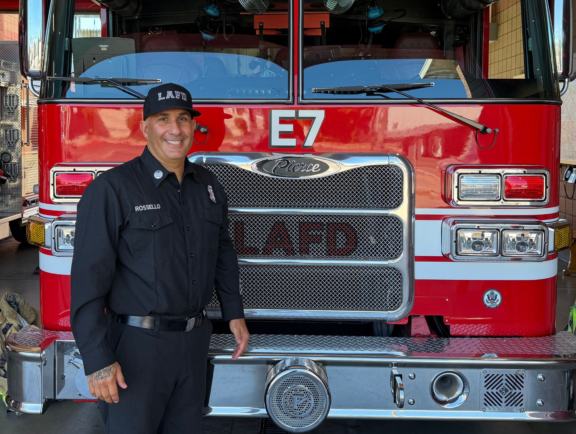 Engineer Brandon Colburn standing in front of an LAFD engine.