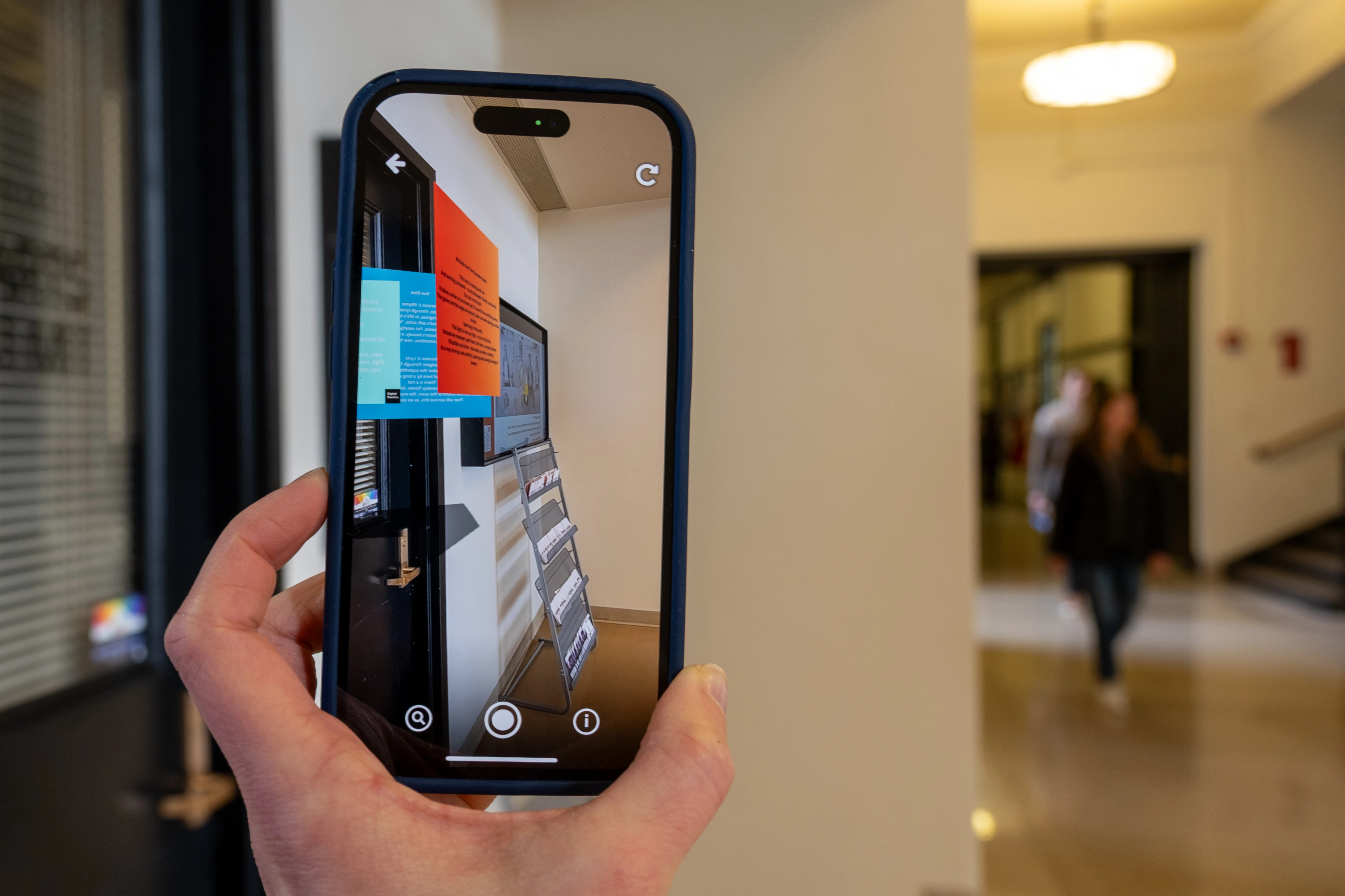 Poems written by Monica Storss viewed on a screen using augmented reality. Credit: HErickson.