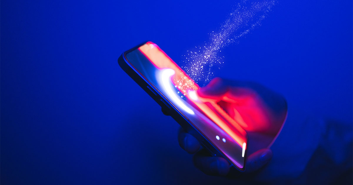 person holding phone - message vs machine | We. Communications