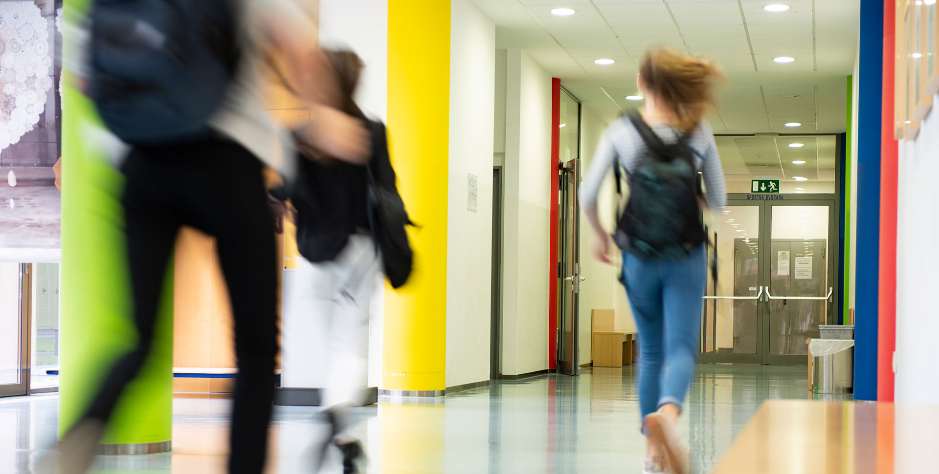 STEM skills cap - kids running through hall | We. Communications