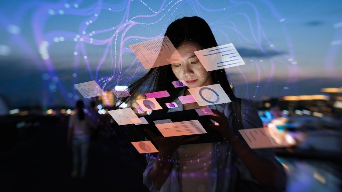 Woman looking at multiple screens