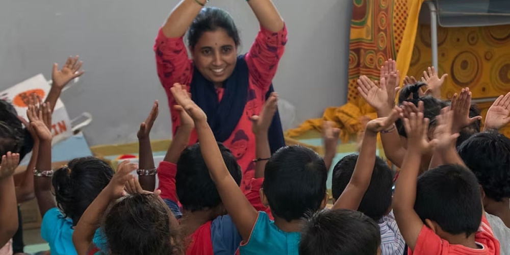 Teacher in front of group of kids