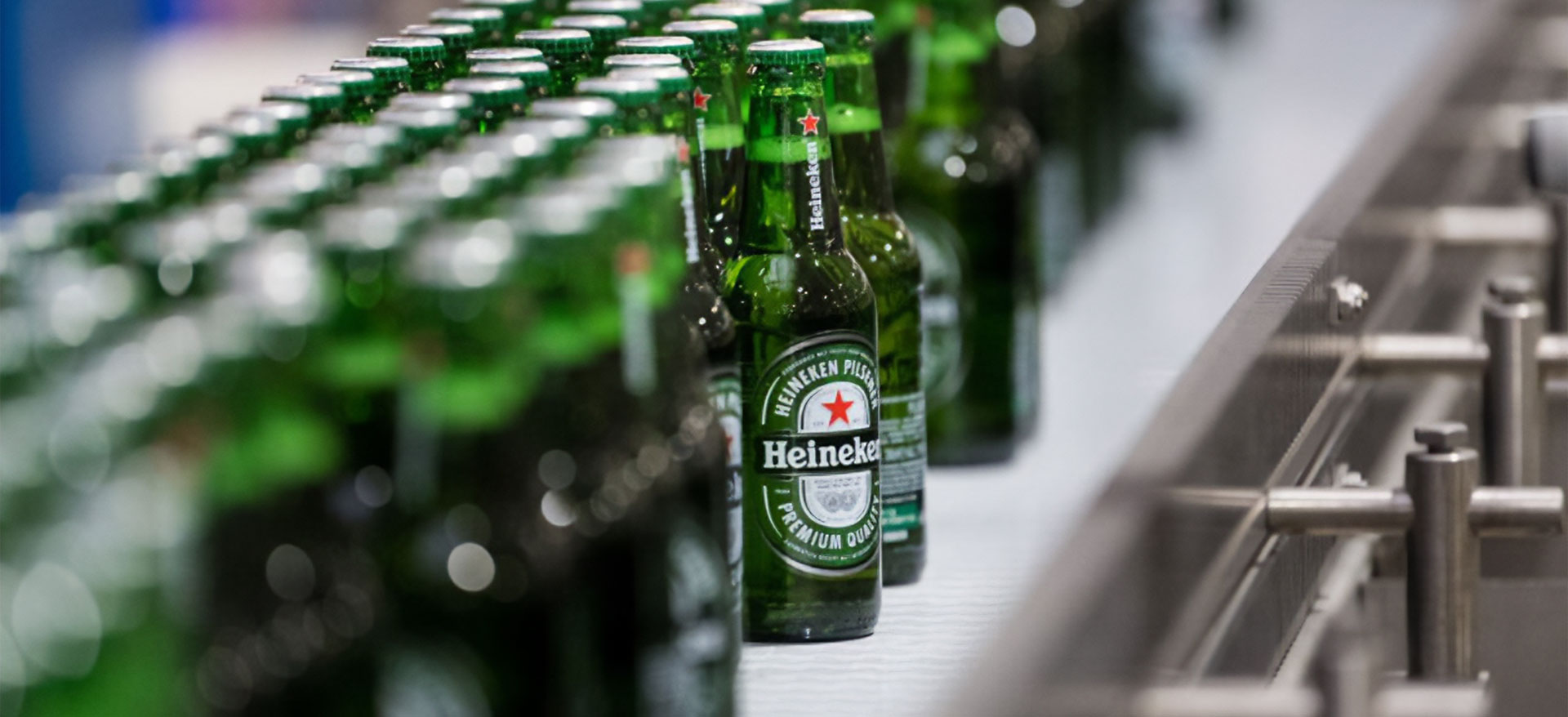 Green Heineken bottles in a line