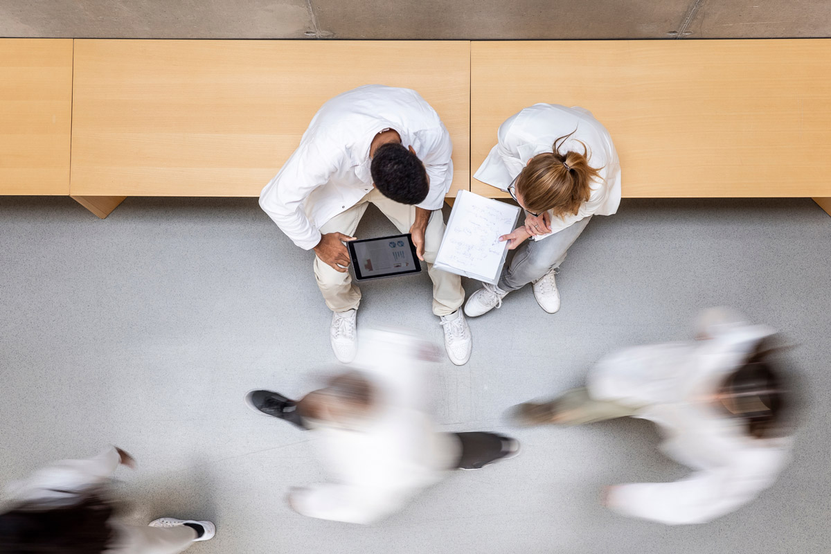 Overhead view in a hospital hallway of healthcare providers