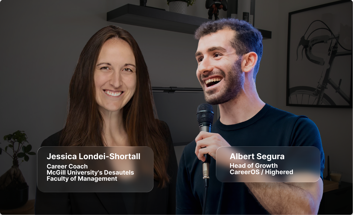 Smiling woman and man speaking into a microphone in an indoor setting with names and titles displayed.