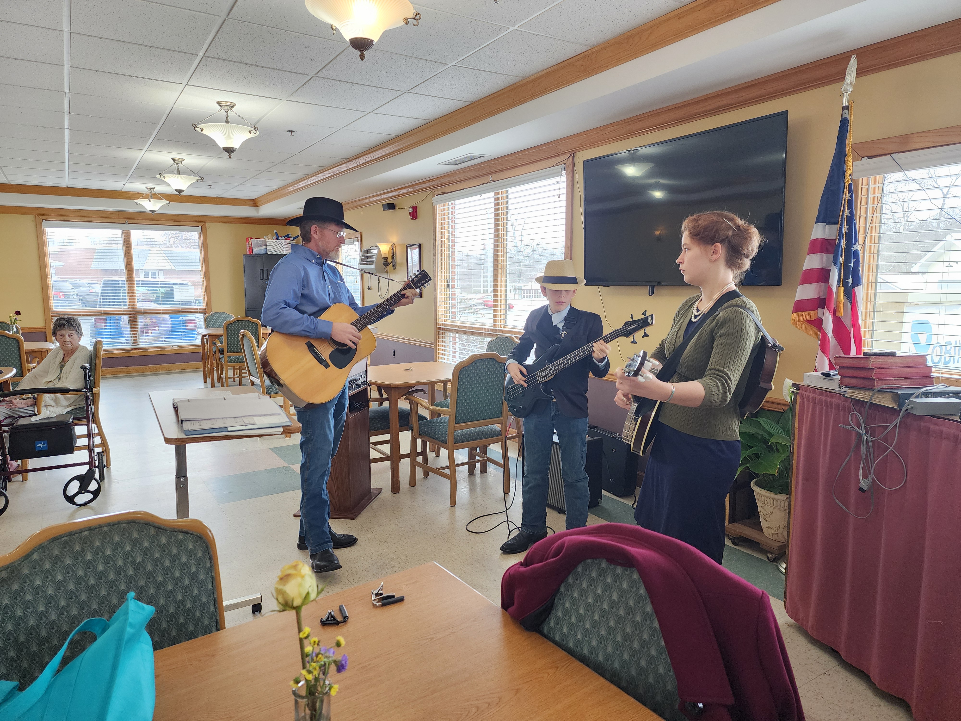 Church musicians playing during hymn sing at local nursing home.