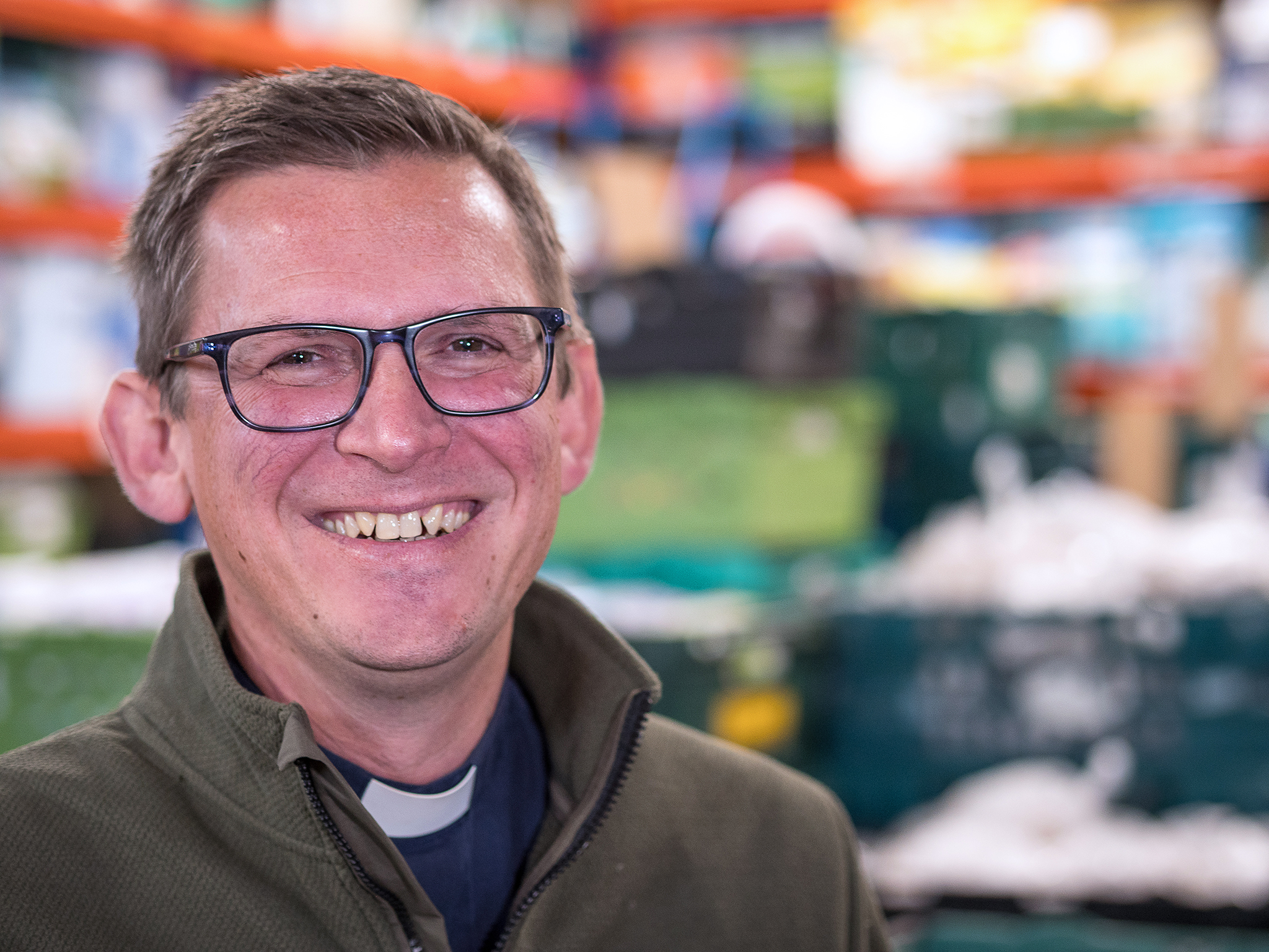 Rev. Andy Murray is pictured smiling to camera