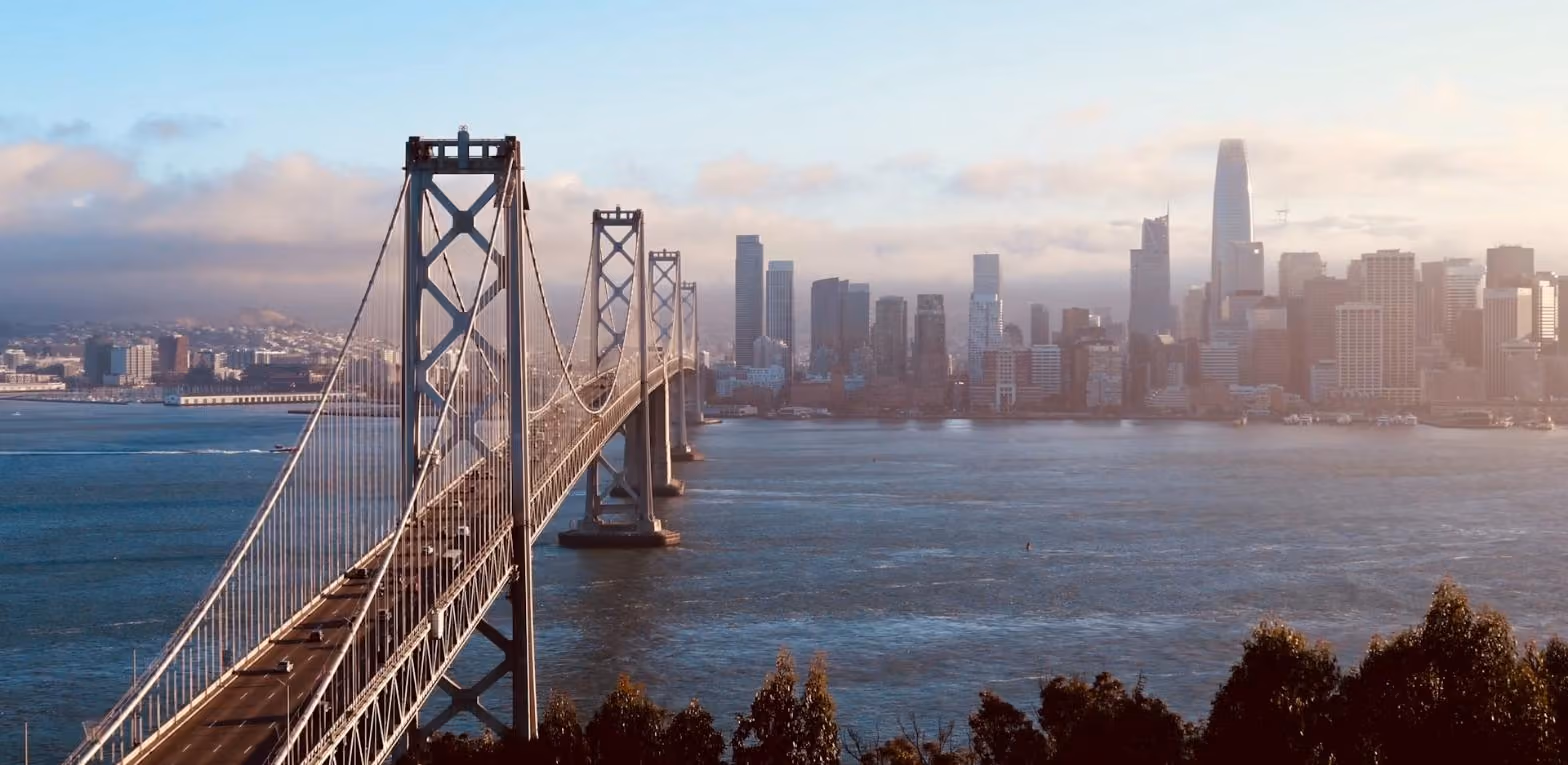 San Francisco Bay Bridge and skyline representing the California cities served by Custom Food Trucks LLC food truck builders