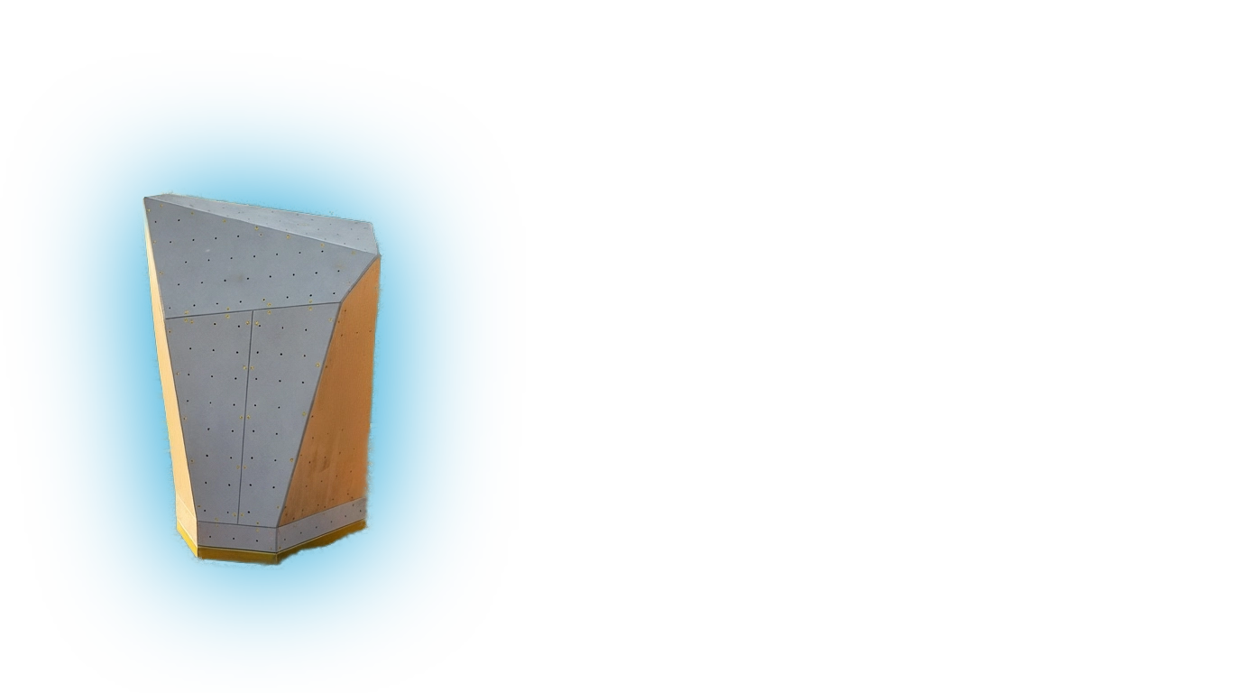 Gray angular climbing boulder with multiple bolt holes on a blue background.