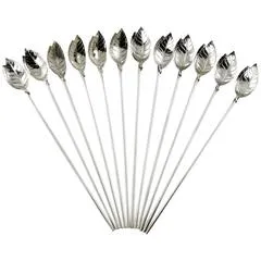Set of twelve silver metal spoons with leaf-shaped bowls arranged in a fan pattern.