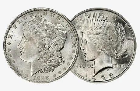 Two silver coins side by side: 1898 Morgan silver dollar and 1923 Peace dollar.