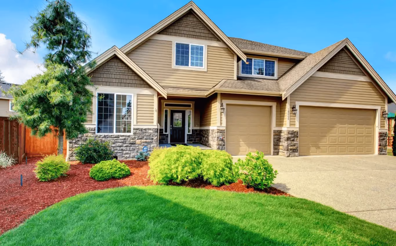 Row of townhomes with mixed siding styles and colors