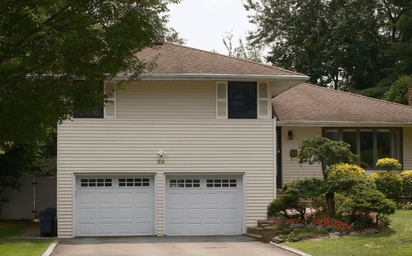 A warm brown shingle roof glowing under sunlight, symbolizing comfort, intimacy, and the beginning of a love story in a peaceful home surrounded by nature.