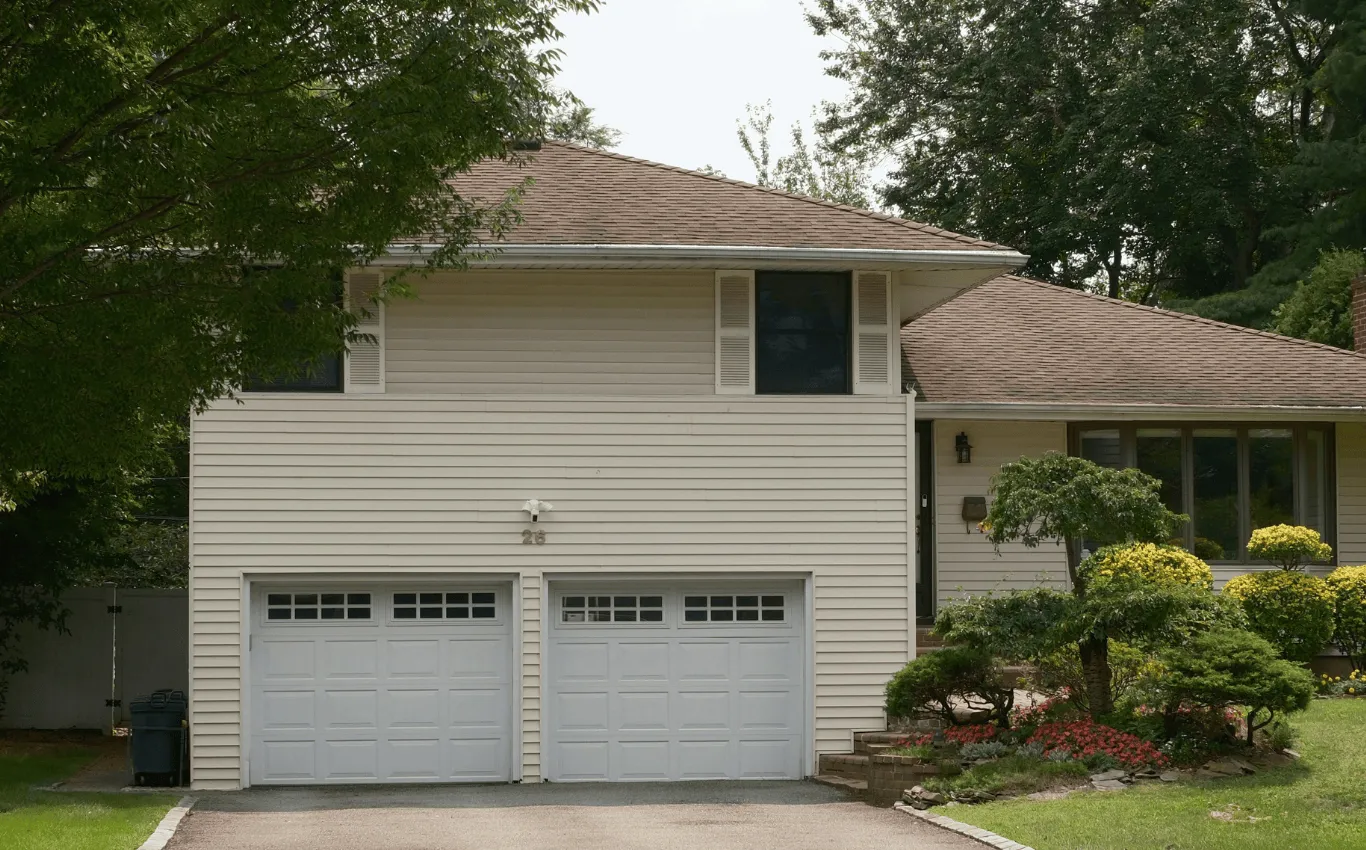 A warm brown shingle roof glowing under sunlight, symbolizing comfort, intimacy, and the beginning of a love story in a peaceful home surrounded by nature.