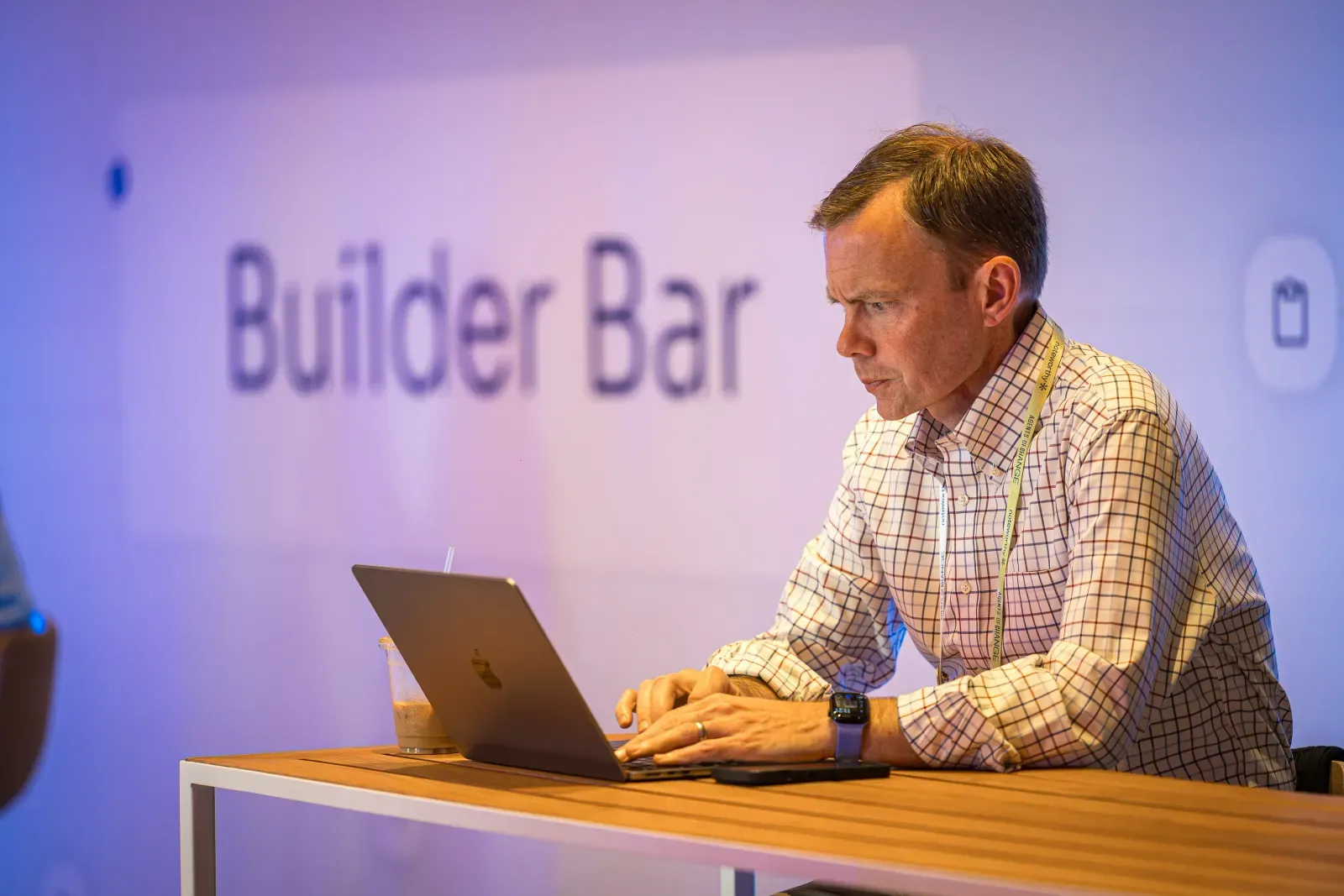 Attendee working on a laptop at the Builder Bar