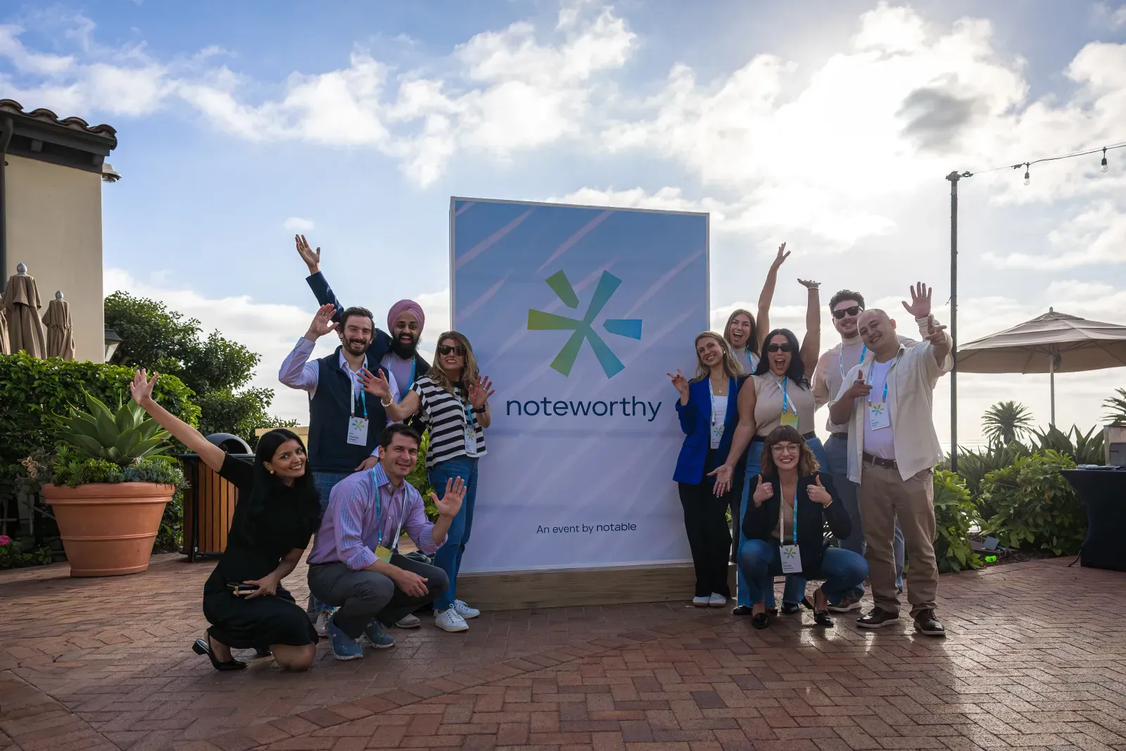 Noteworthy team group photo on the patio