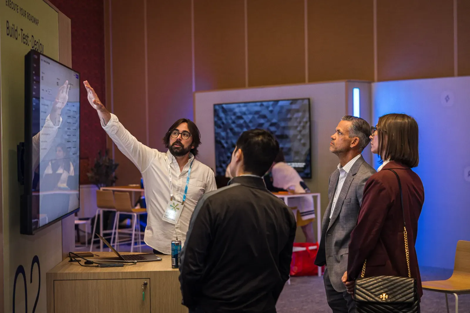 Presenter walking attendees through a demo screen