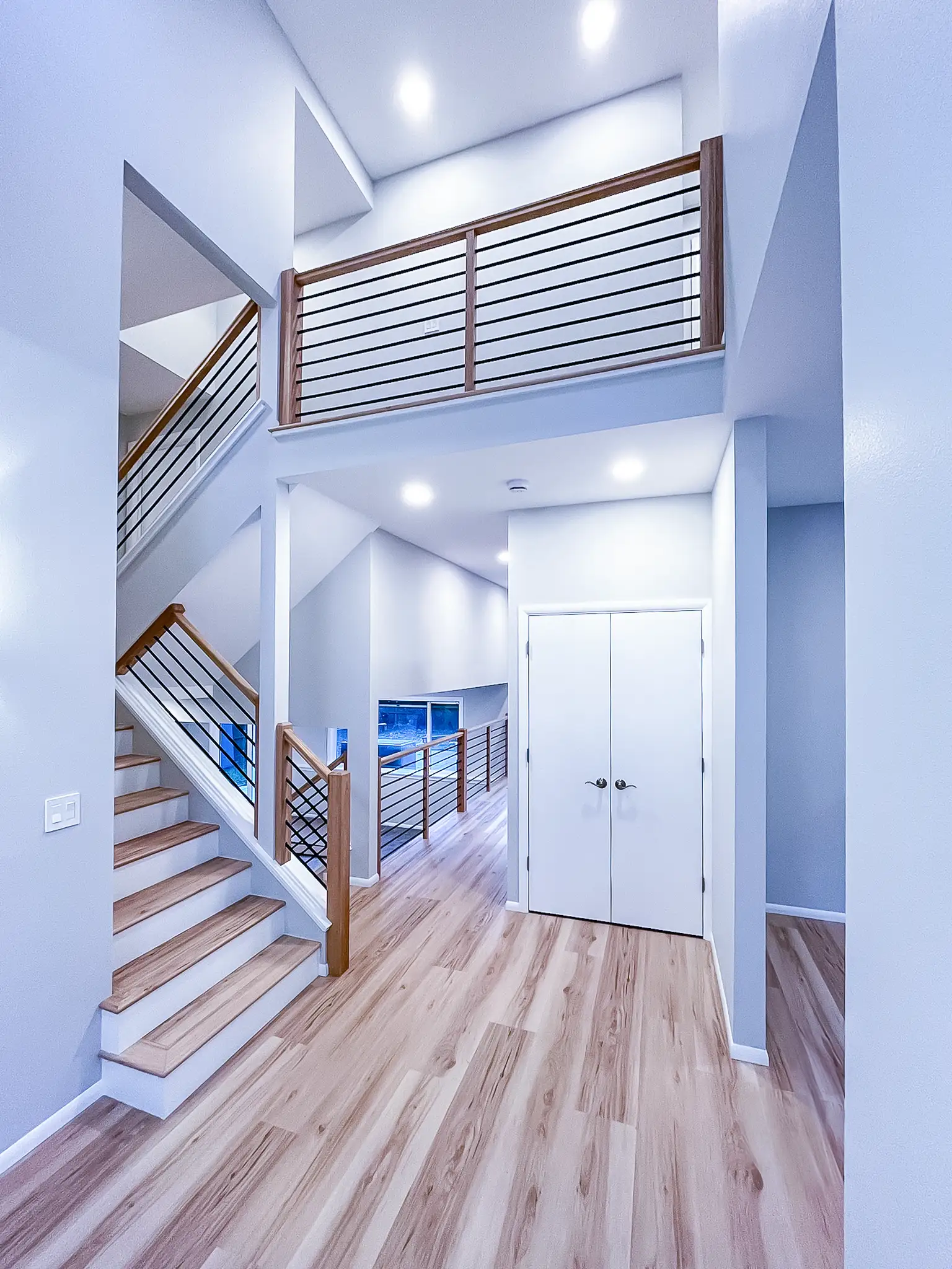 Photo of an entryway with a vaulted ceiling in a home renovated by Thornberg Construction.