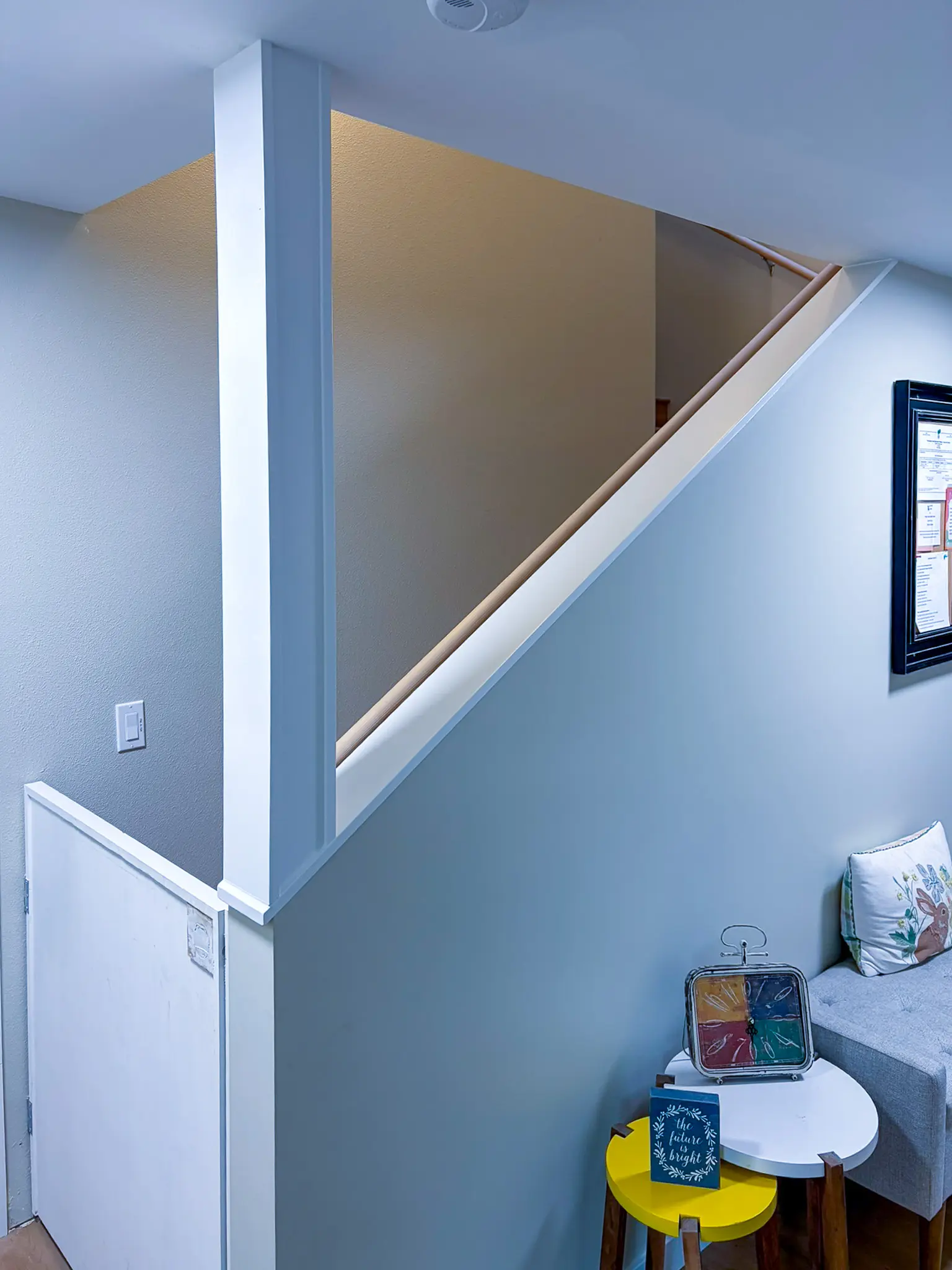 Stairway with a new handrail and a small seating nook in the remodeled Redmond, WA daycare.