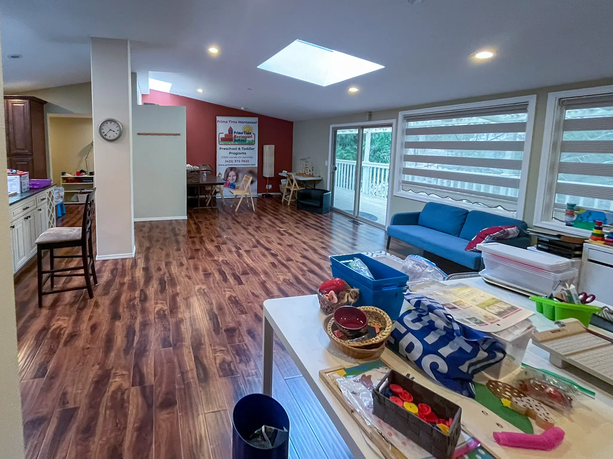Open interior common room with a skylight in a Redmond, WA commercial building before a daycare remodel.