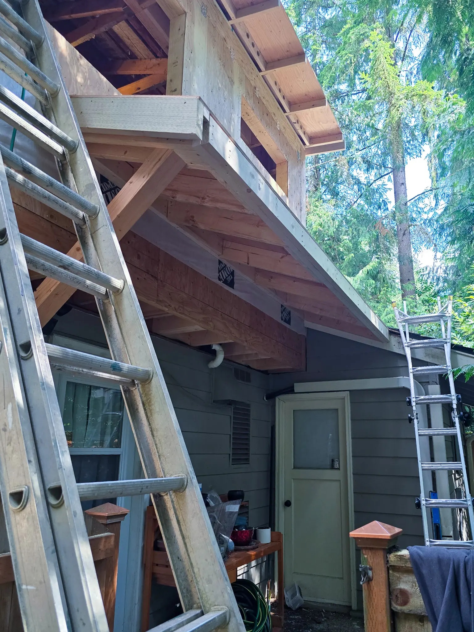 Exterior structural framing for a bump-out addition on a Bellevue, WA home, viewed from a different angle.