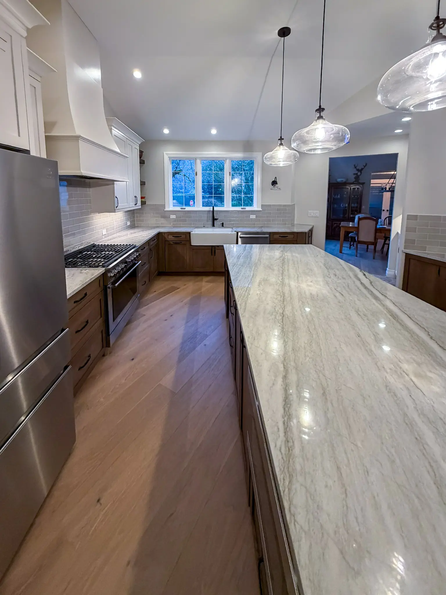 Kitchen island and range with a view into the dining room after a whole-home remodel in Sammamish, WA.