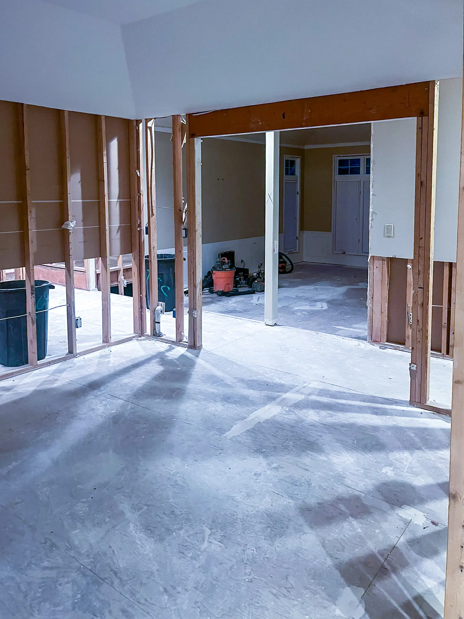 Widened framed doorway opening between gutted rooms during a whole-home remodel in Sammamish, WA.