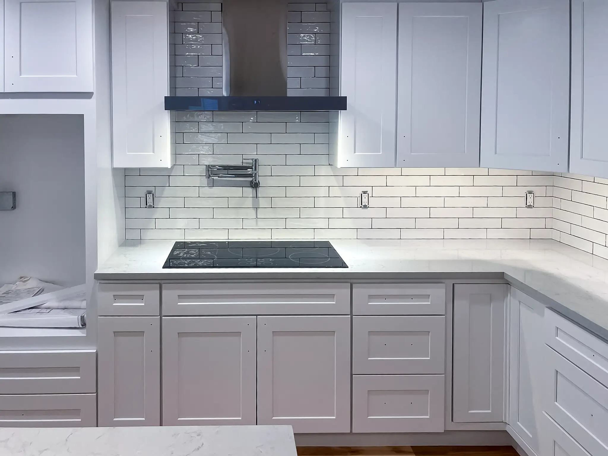 Kitchen sink and quartz-look countertop in a remodeled Kirkland, WA rambler.