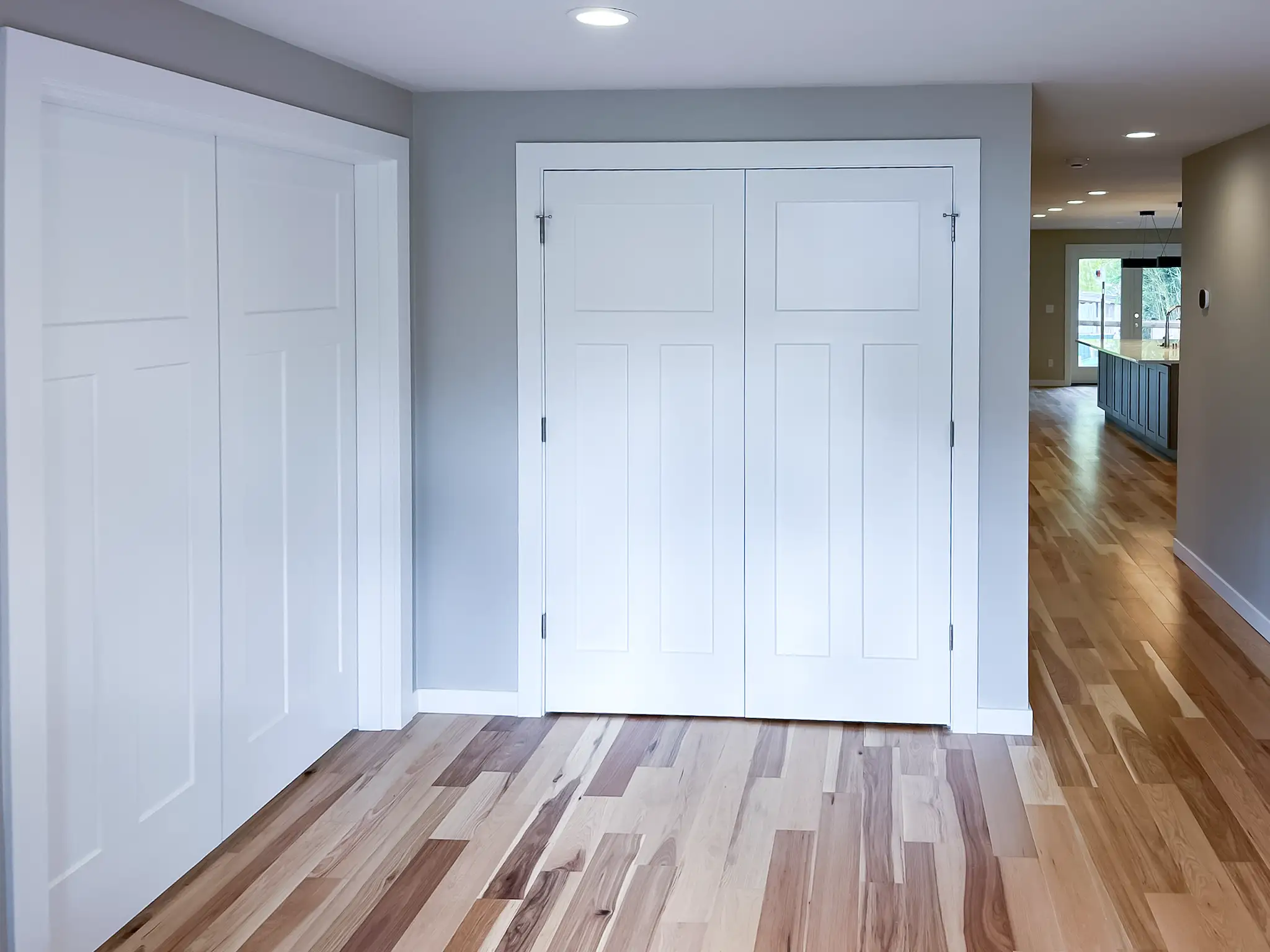 Remodeled home entrance opening into the kitchen in a Kirkland, WA rambler.