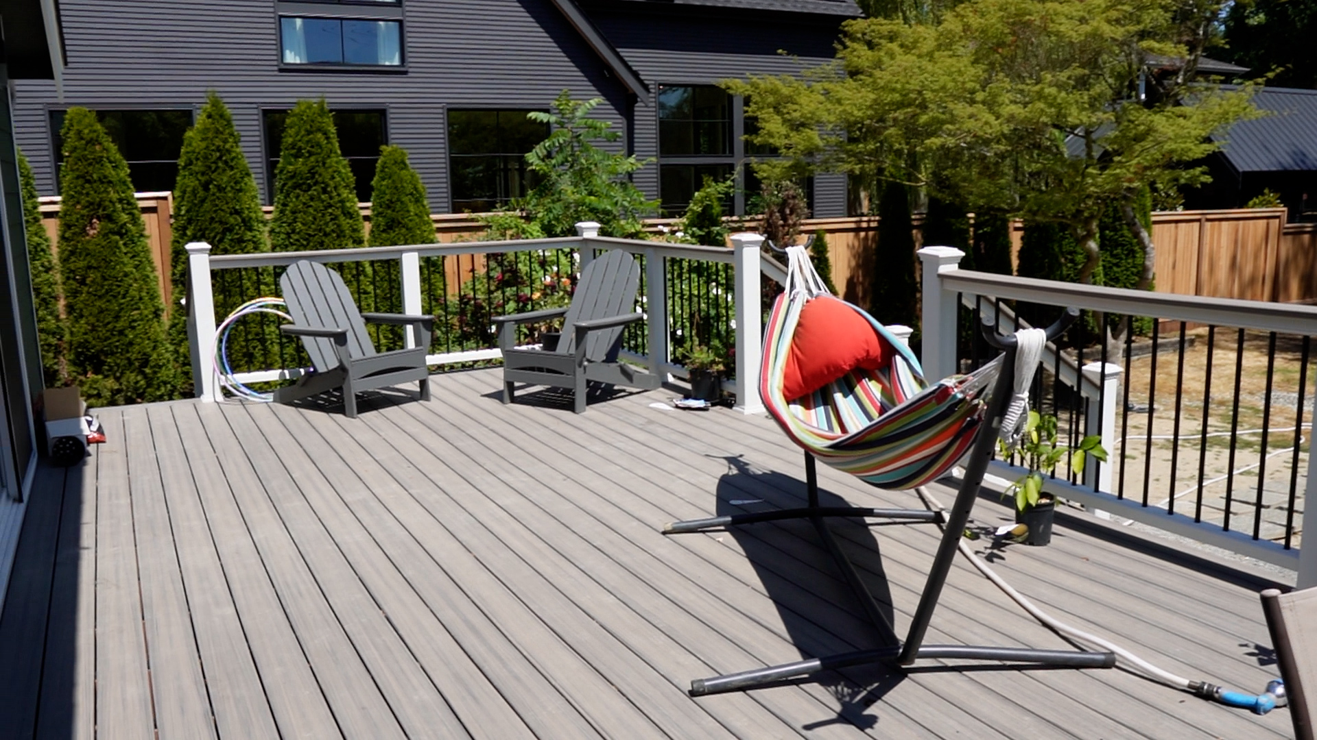 Angled view of the rebuilt backyard deck and stairway at a Kirkland, WA rambler.