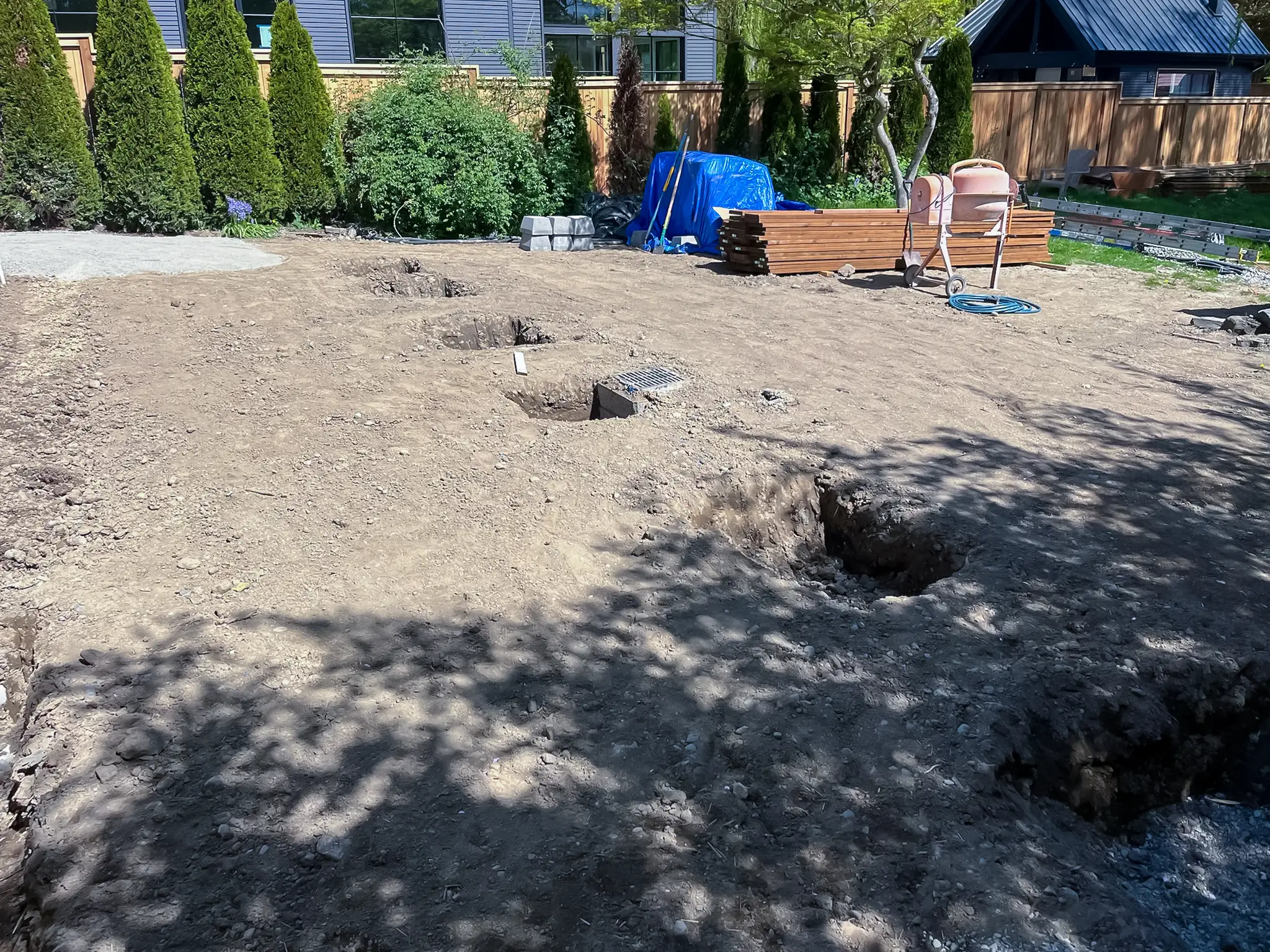 Backyard excavation for a rebuilt deck at a Kirkland, WA rambler.