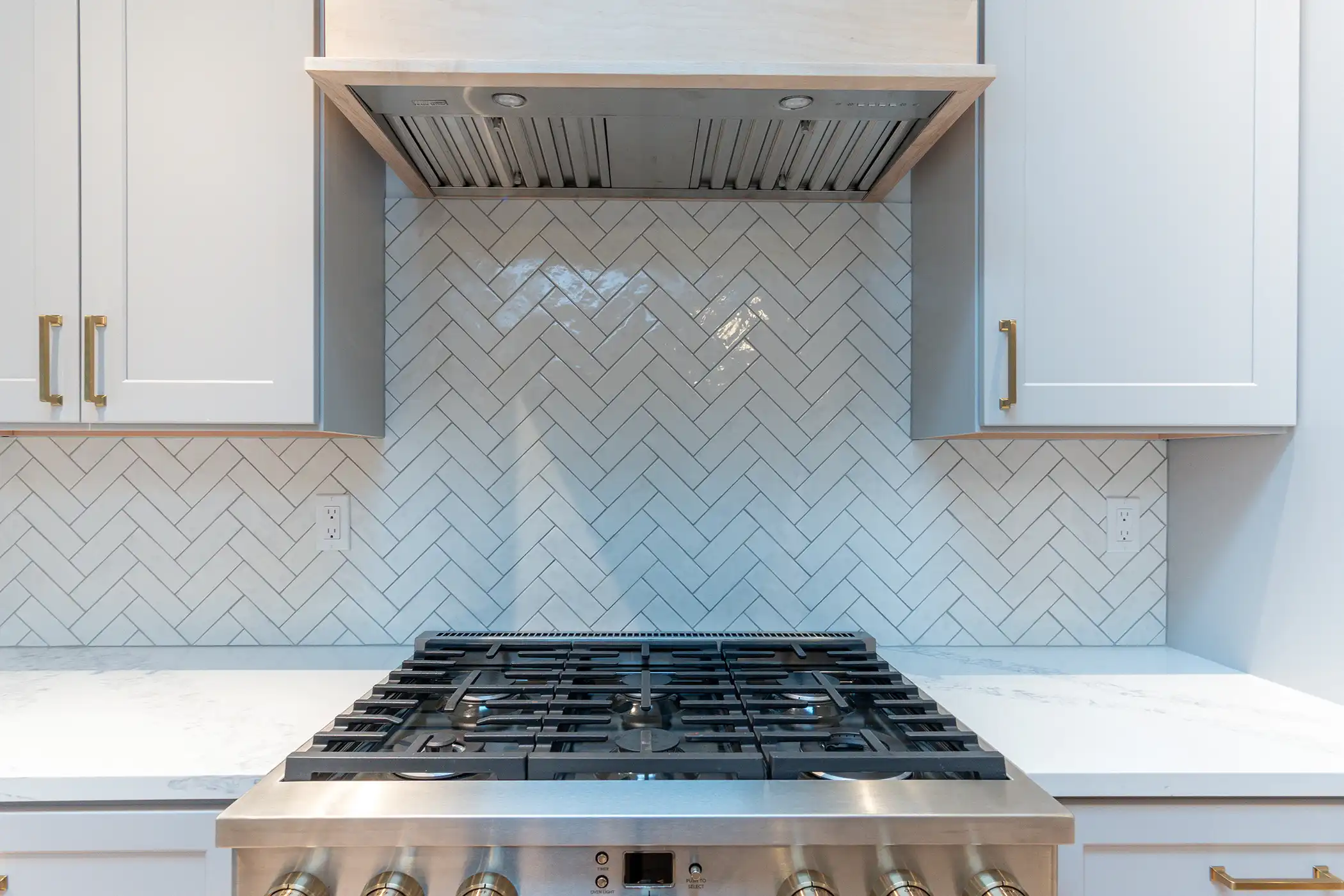 Range and hood in the remodeled kitchen of a Kirkland, WA home.