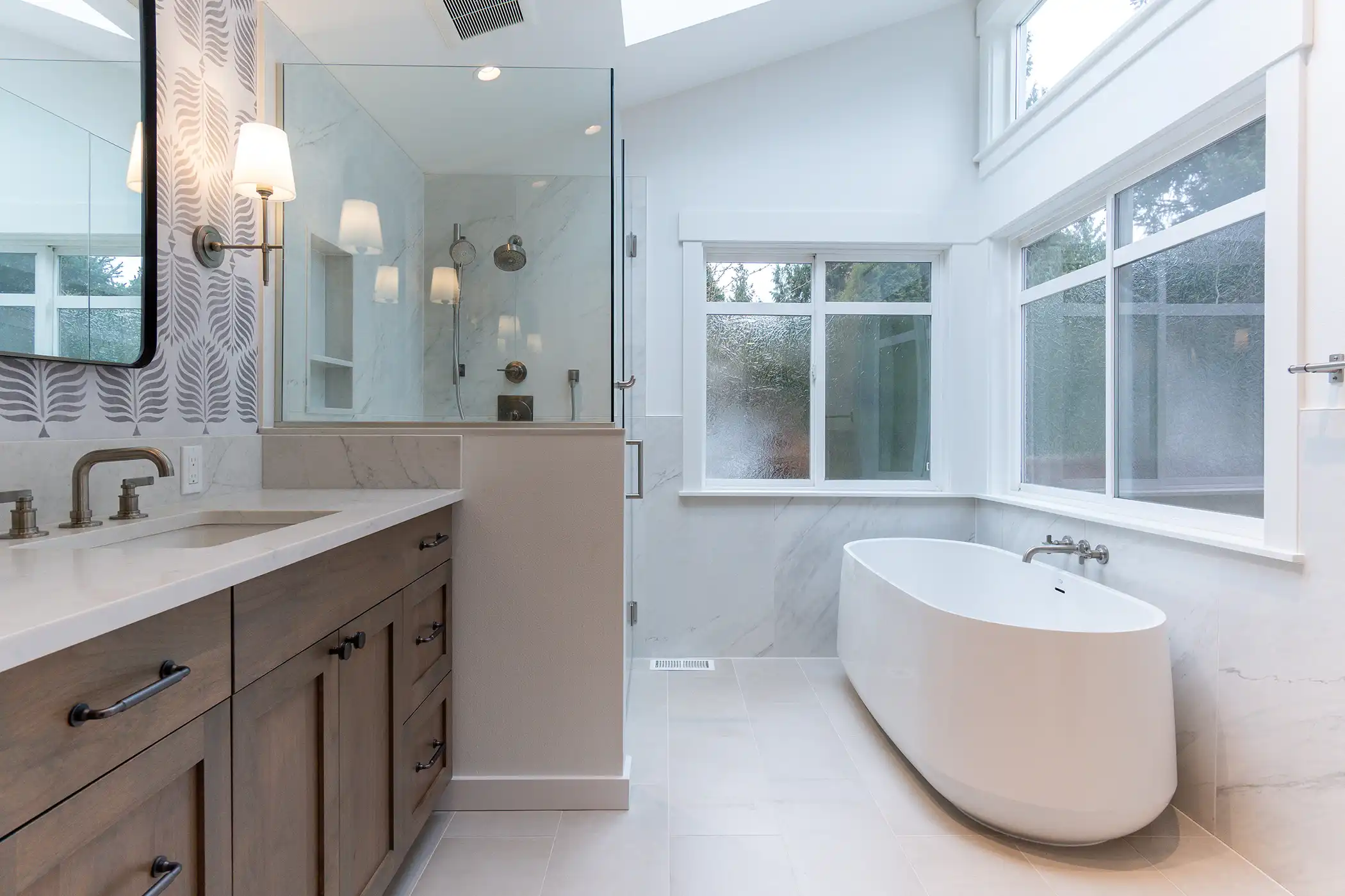 Front view of the freestanding soaking tub in the remodeled bathroom of a Kirkland, WA home.