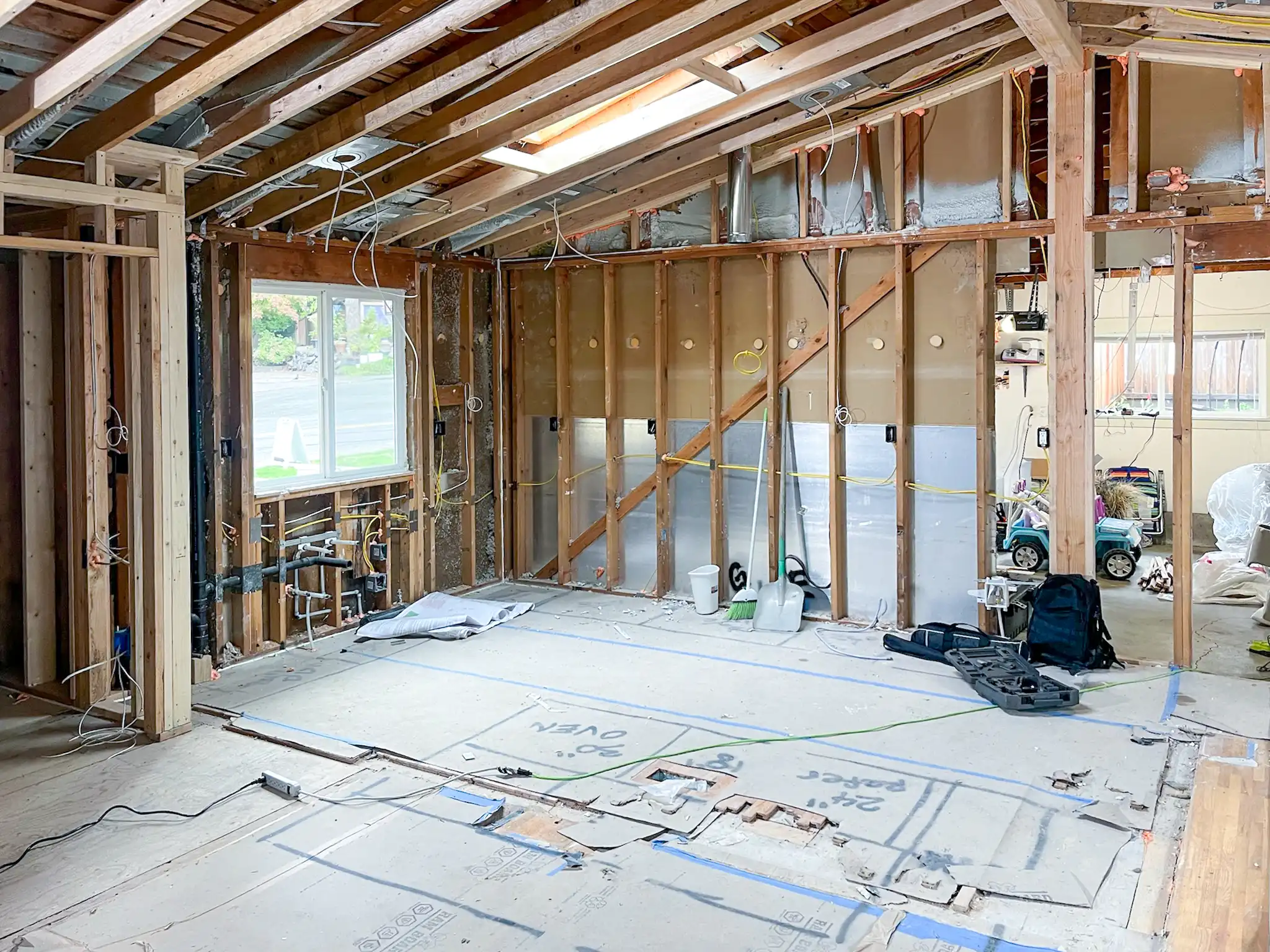 Downstairs living space stripped to the studs before a Kirkland, WA kitchen and bathroom remodel.