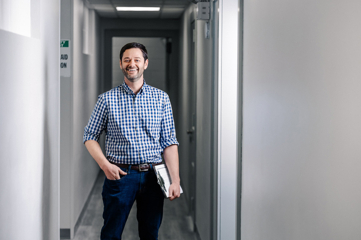 kamin employee smiling standing in hallway in macon georgia lab