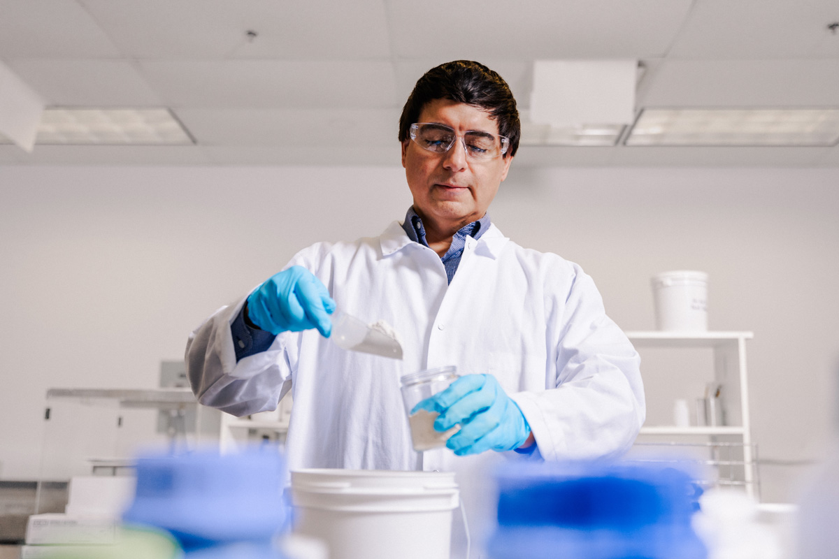 laboratory technician analyzing kaolin clay