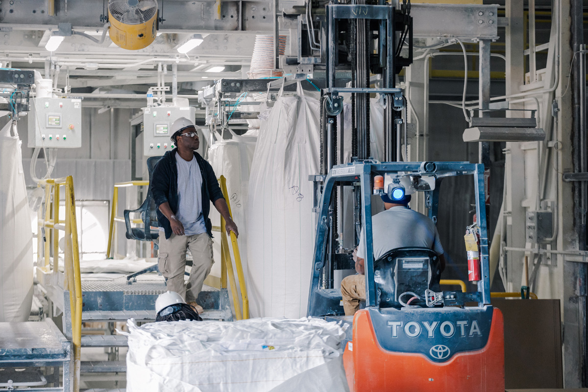 kamin employees working at kaolin manufacturing plant