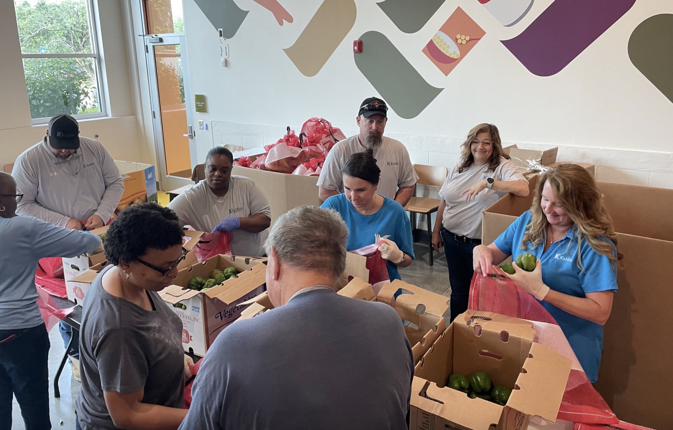 kamin volunteers at golden harvest food bank georgia