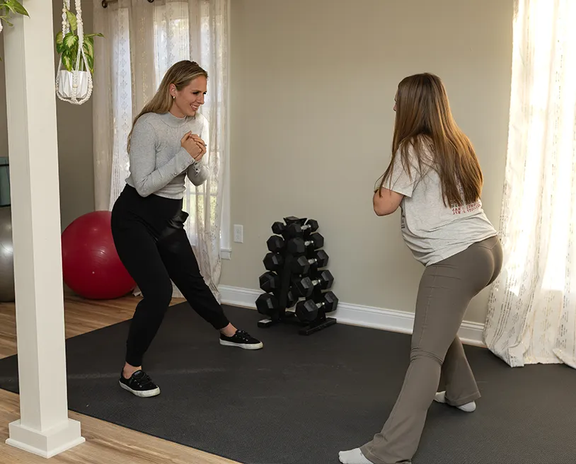 Doctor preforming a leg stretch on a patient