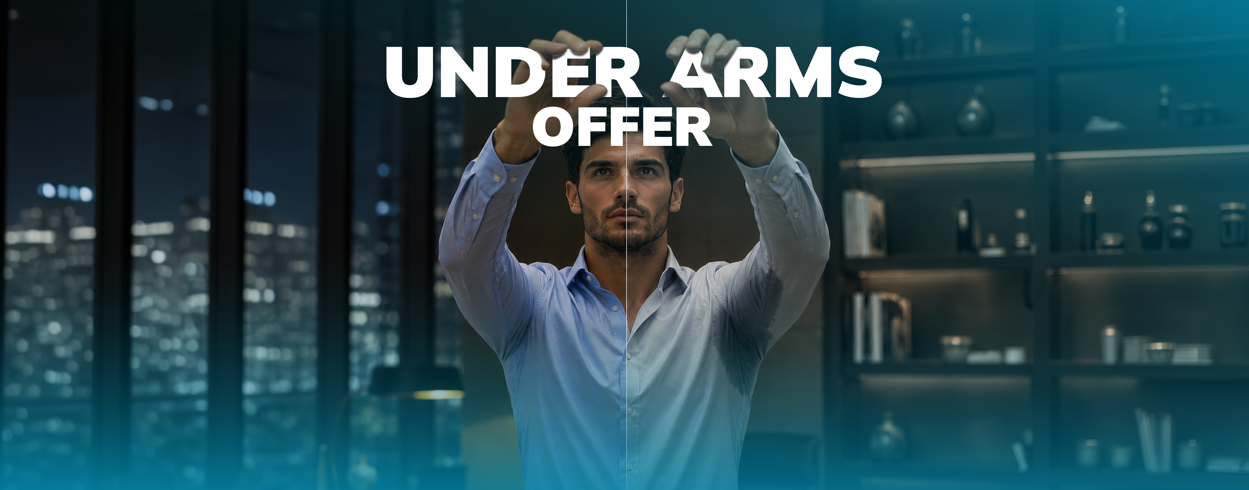 Man in blue shirt raising his arms with sweat stains under the arms in an indoor office setting at night.