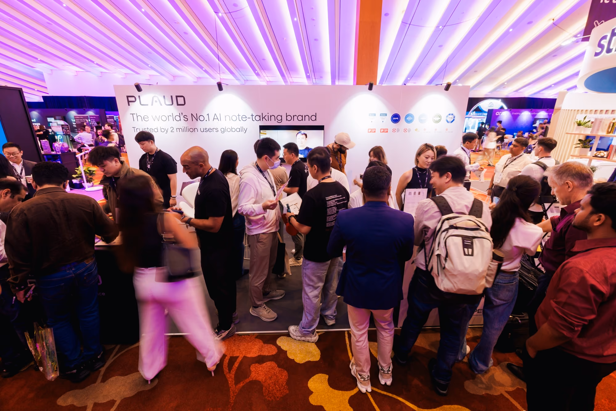 Crowd gathered at the Plaud booth under a "World's No.1 AI note-taking brand" banner at SuperAI 2026.